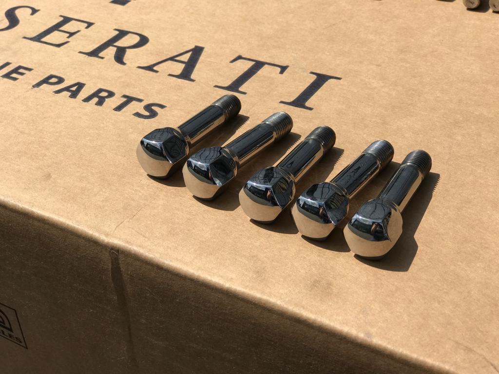 Five as new Maserati wheel studs with part number 803384